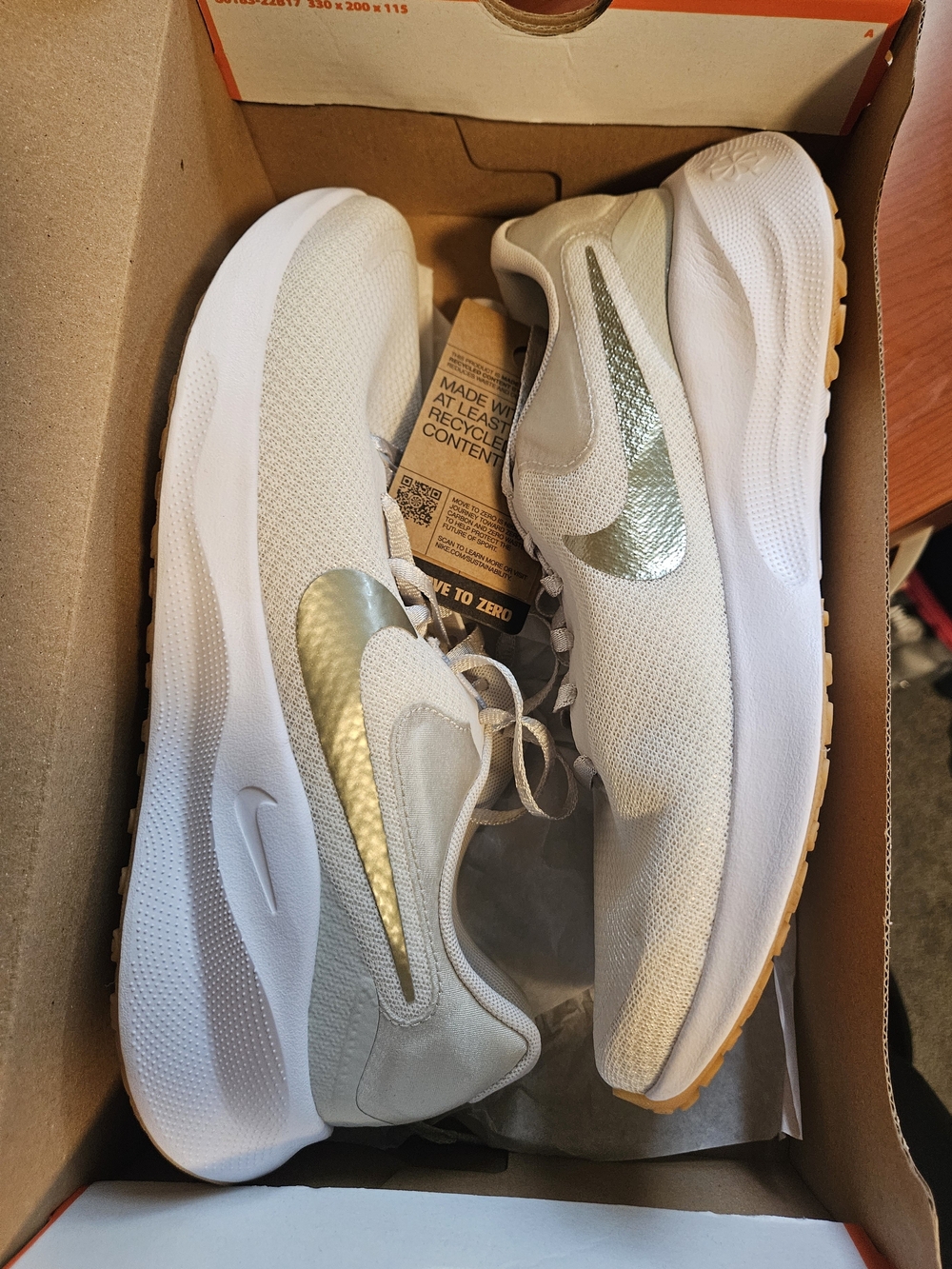 Nike Women's Athletic Sneakers in White with Metallic Gold Swoosh